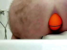 Huge 12cm wide soccer ball slides out of my ass on side of bath.